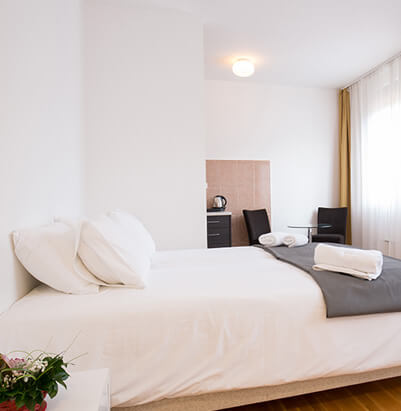 Bright furnished bedroom staged for short-term rental guests
